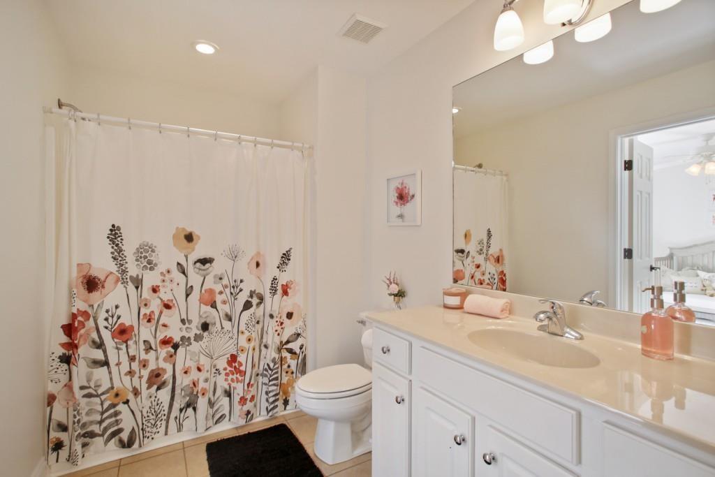 3761 Falls Trail Winston, GA 30187 - Photo 29 of 45 a bathroom with a granite countertop sink a toilet and a mirror