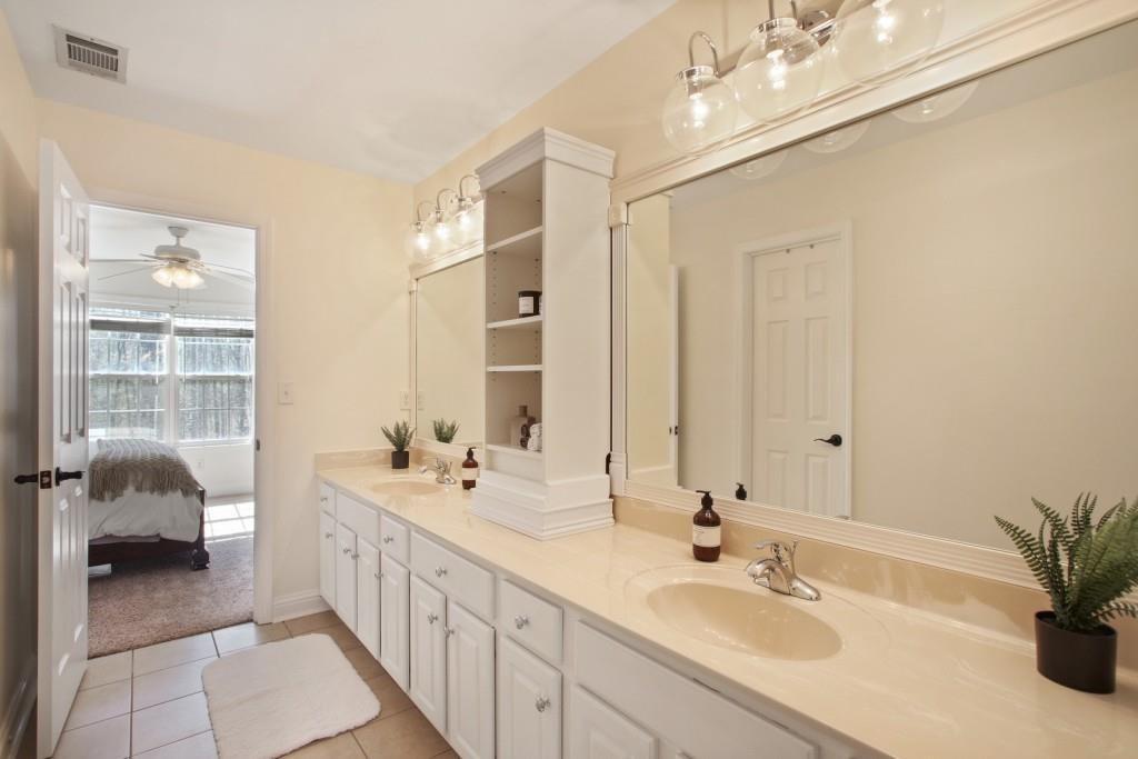 3761 Falls Trail Winston, GA 30187 - Photo 30 of 45 a bathroom with a double vanity sink a and a mirror