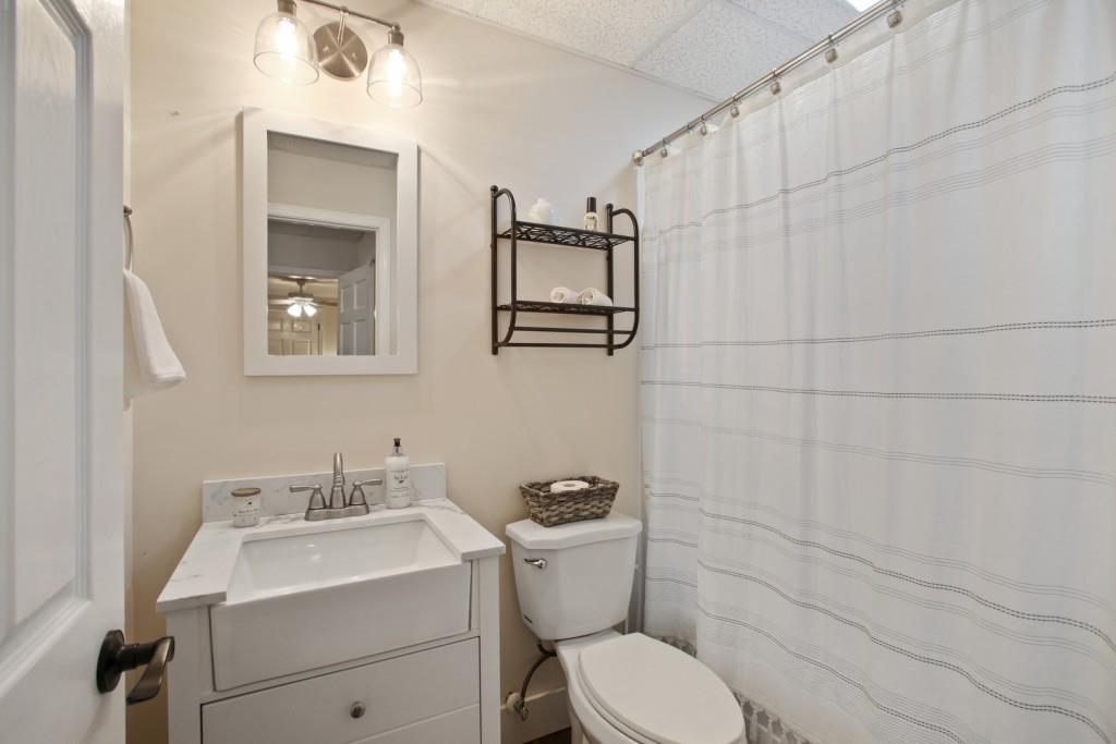 3761 Falls Trail Winston, GA 30187 - Photo 32 of 45 a bathroom with a toilet sink and mirror