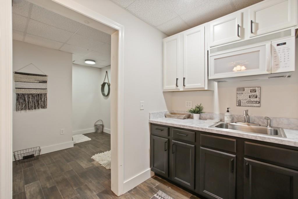 3761 Falls Trail Winston, GA 30187 - Photo 33 of 45 a kitchen with a sink and cabinets
