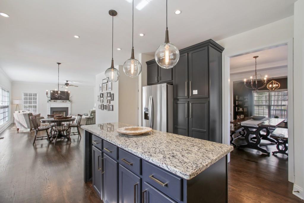 3761 Falls Trail Winston, GA 30187 - Photo 10 of 45 a large kitchen with granite countertop a stove oven and a dining table