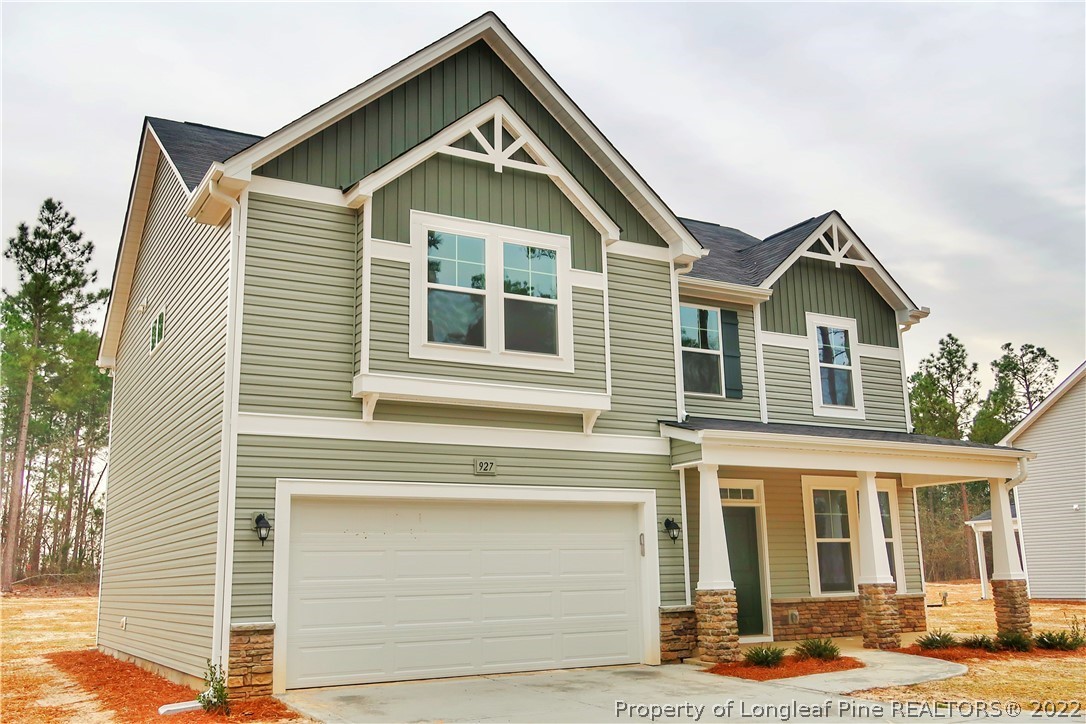 927 Montrose Road Raeford, NC 28376 - Photo 1 of 17 a front view of a house with a yard