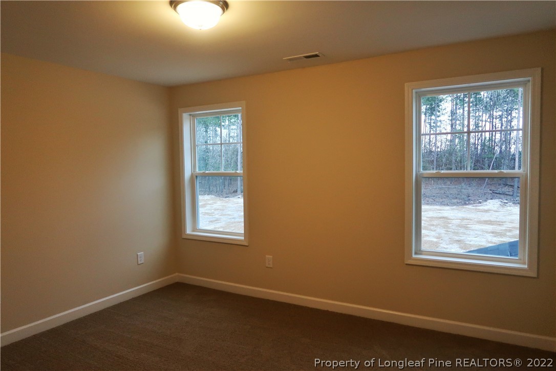 927 Montrose Road Raeford, NC 28376 - Photo 12 of 17 an empty room with windows