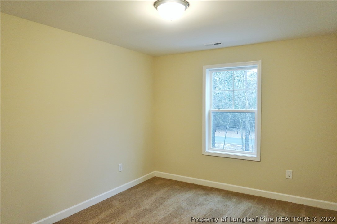927 Montrose Road Raeford, NC 28376 - Photo 13 of 17 an empty room with a window