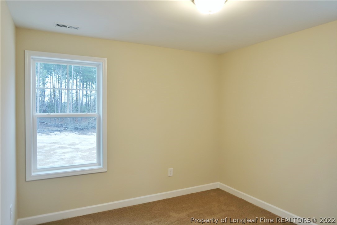 927 Montrose Road Raeford, NC 28376 - Photo 14 of 17 an empty room with a window