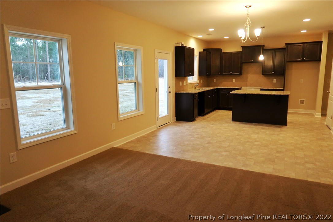 927 Montrose Road Raeford, NC 28376 - Photo 7 of 17 a view of kitchen and kitchen with a sink