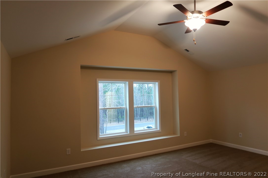 927 Montrose Road Raeford, NC 28376 - Photo 8 of 17 an empty room with a window and a fan