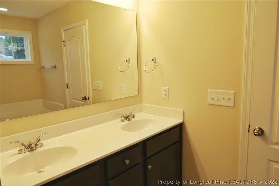 927 Montrose Road Raeford, NC 28376 - Photo 9 of 17 a bathroom with a sink and a mirror