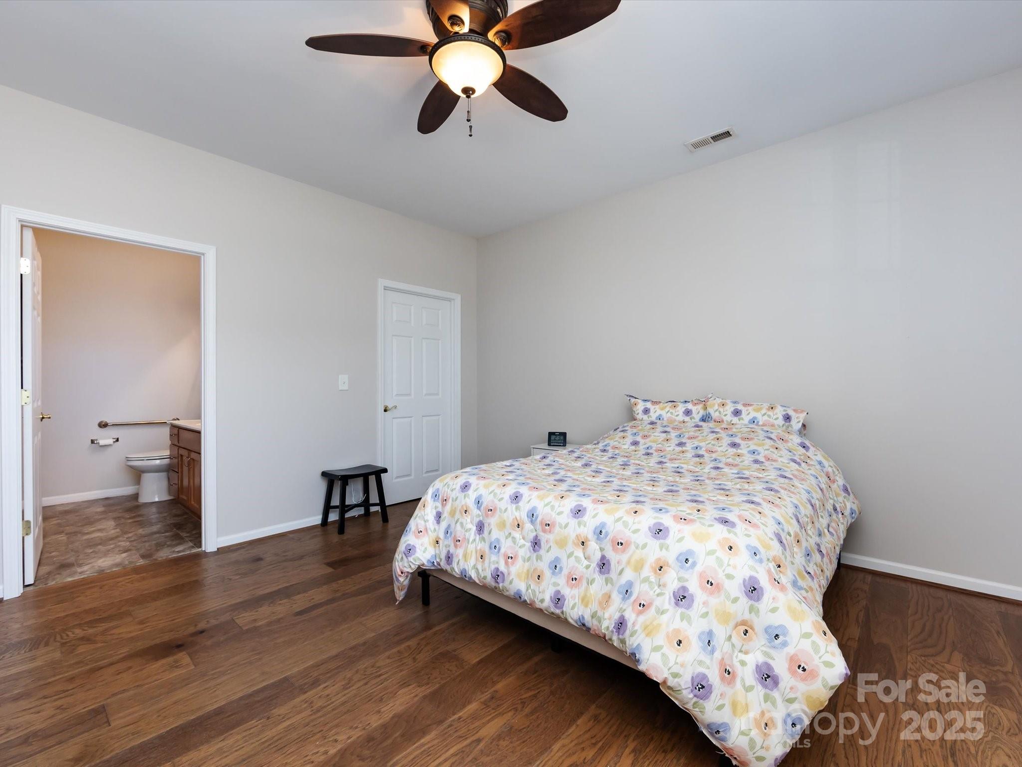 864 Ledgestone Court Fort Mill, SC 29708 - Photo 17 of 30 a bedroom with a bed and wooden floor