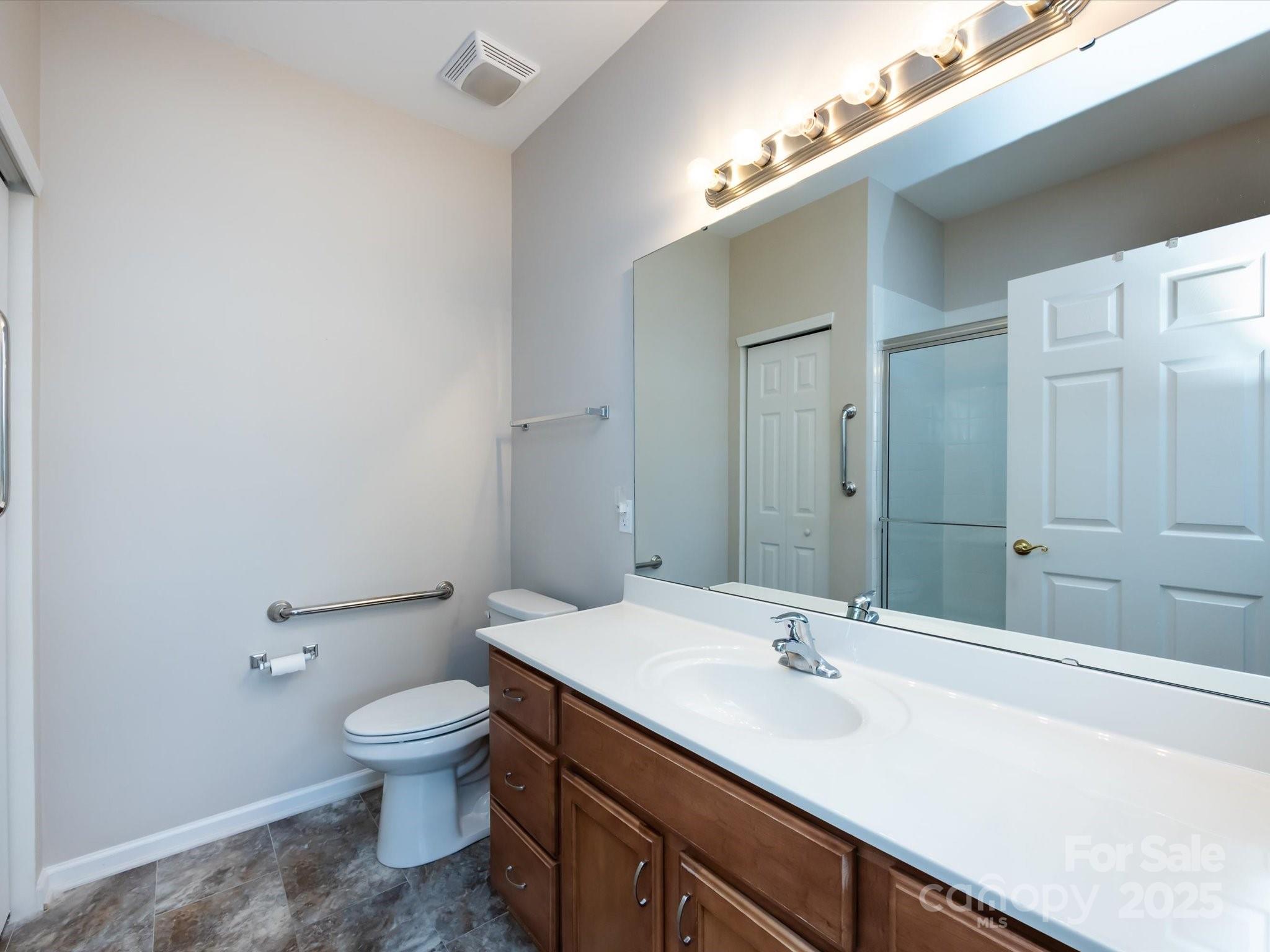 864 Ledgestone Court Fort Mill, SC 29708 - Photo 19 of 30 a bathroom with a sink a toilet and shower