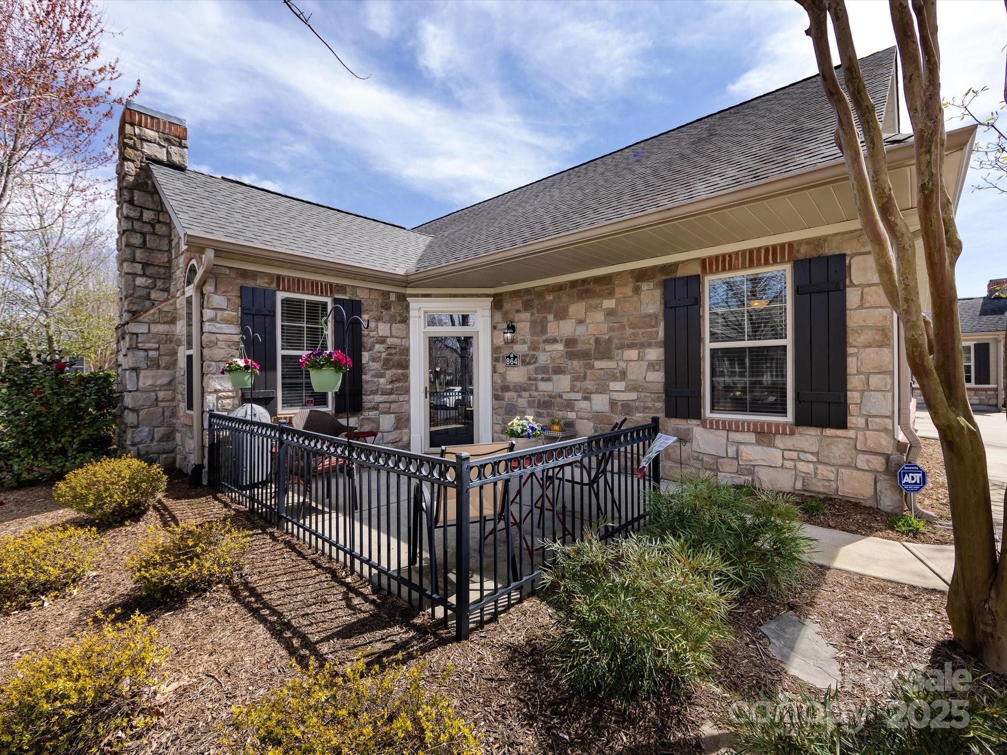 864 Ledgestone Court Fort Mill, SC 29708 - Photo 2 of 30 a view of a house with porch and furniture