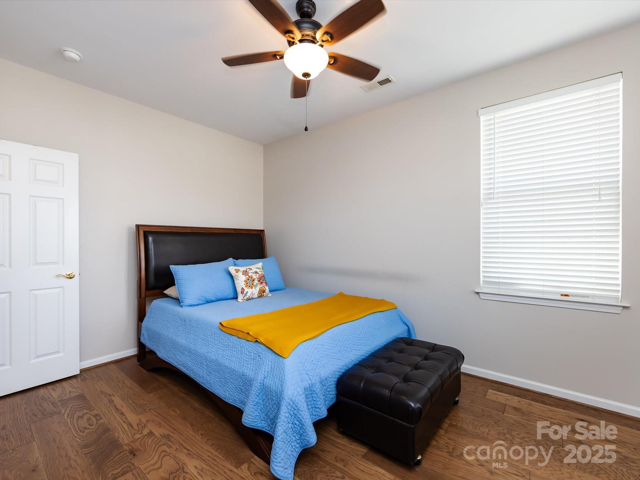 864 Ledgestone Court Fort Mill, SC 29708 - Photo 22 of 30 a bedroom with a bed and a ceiling fan