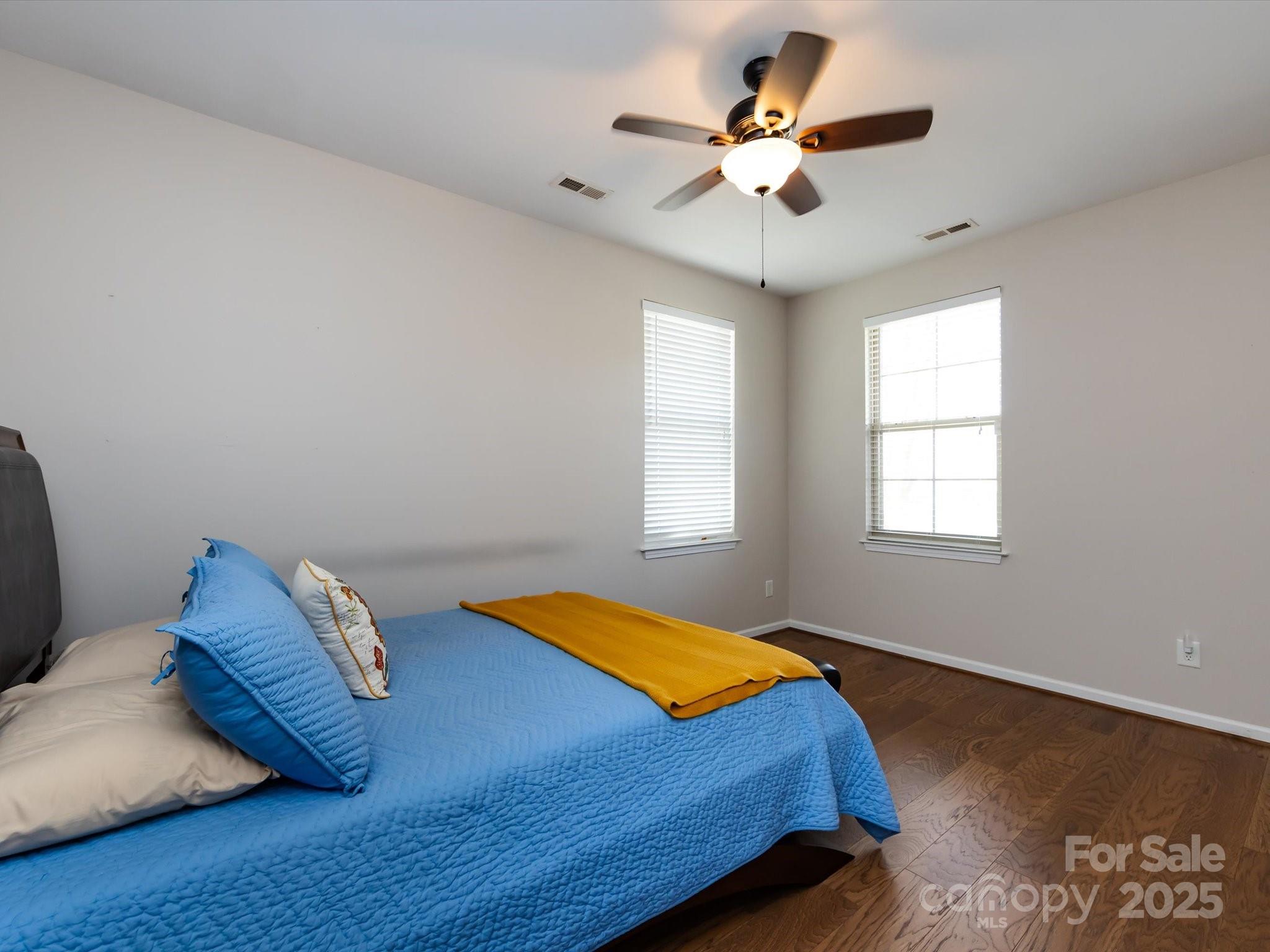 864 Ledgestone Court Fort Mill, SC 29708 - Photo 23 of 30 a bedroom with a bed and a chandelier
