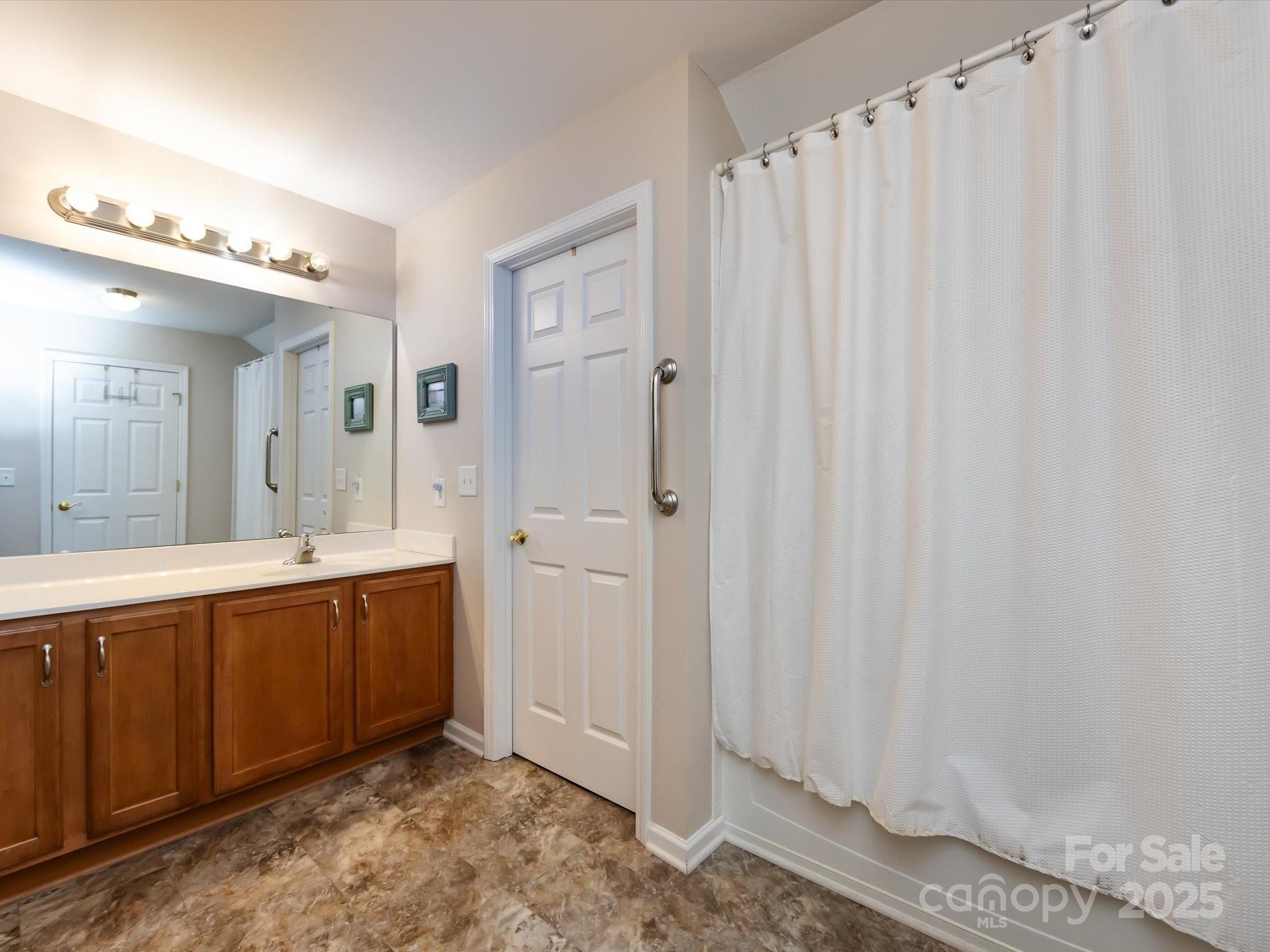 864 Ledgestone Court Fort Mill, SC 29708 - Photo 28 of 30 a spacious bathroom with a double vanity sink and a mirror