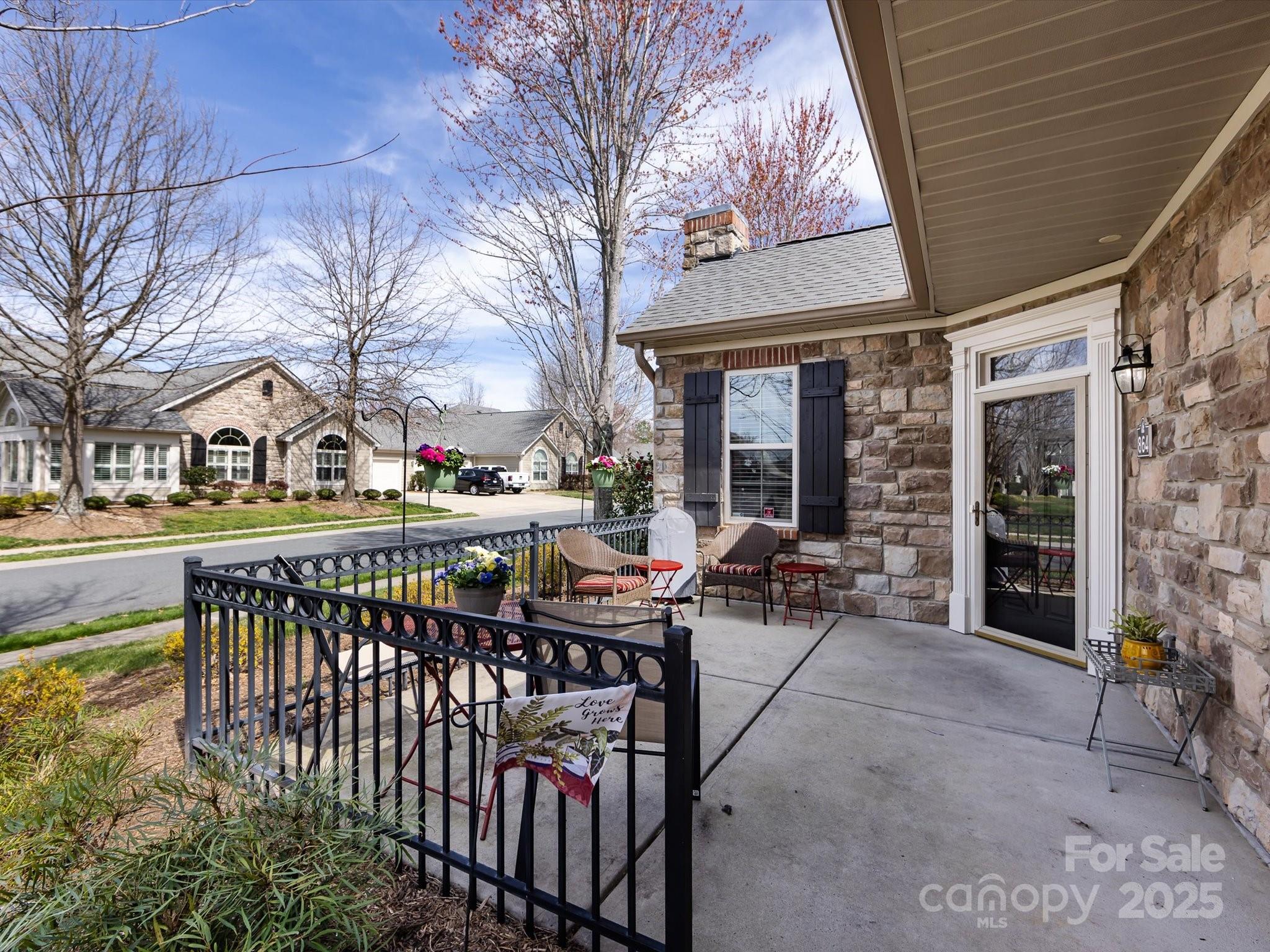 864 Ledgestone Court Fort Mill, SC 29708 - Photo 3 of 30 a view of a chairs and tables in the patio