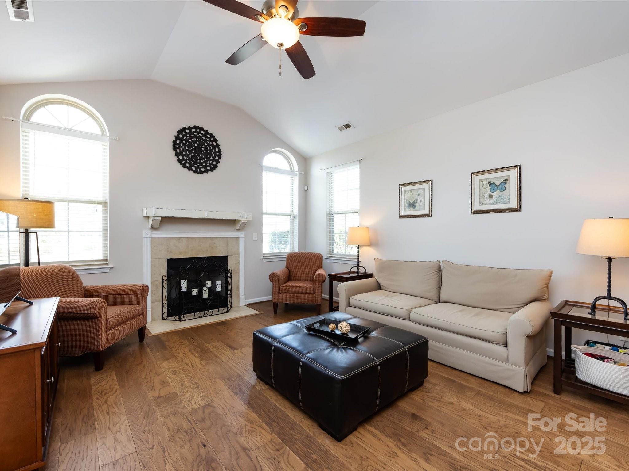 864 Ledgestone Court Fort Mill, SC 29708 - Photo 7 of 30 a living room with furniture and a fireplace
