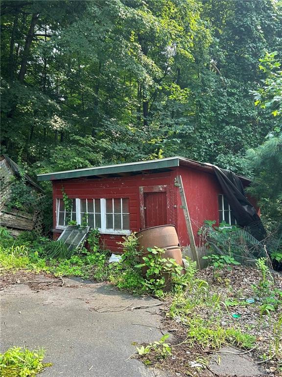 372 Center Gas Road New Salem, PA 15468 - Photo 24 of 33 a red brick house with trees in the background