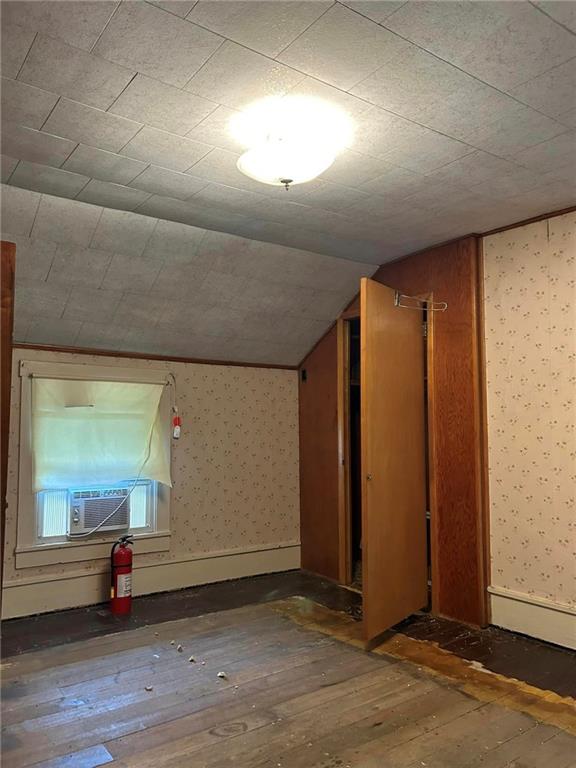 372 Center Gas Road New Salem, PA 15468 - Photo 10 of 33 an empty room with wooden floor and windows