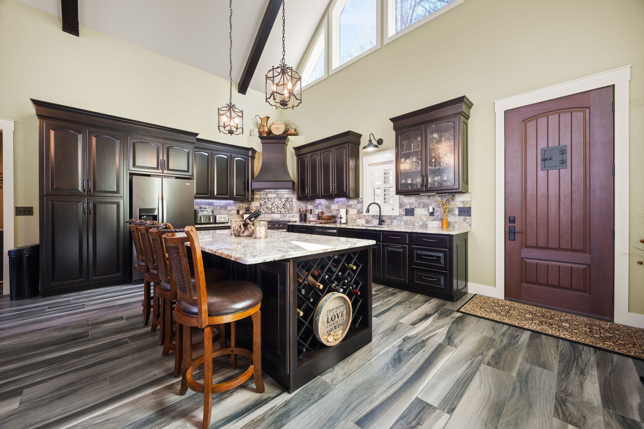 354 Mountain Farms Road Signal Mountain, TN 37377 - Photo 13 of 74 a kitchen with a table chairs refrigerator and cabinets