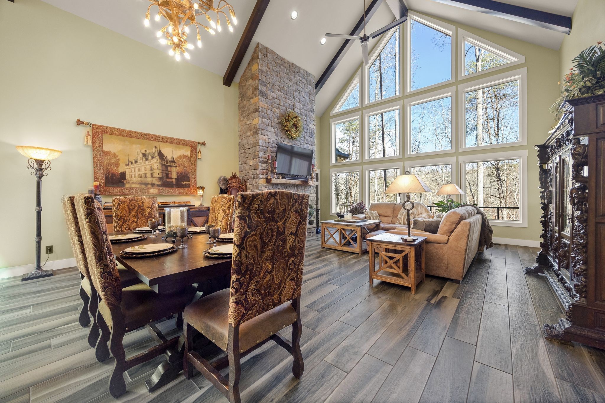354 Mountain Farms Road Signal Mountain, TN 37377 - Photo 18 of 74 a dining room with furniture a chandelier and wooden floor