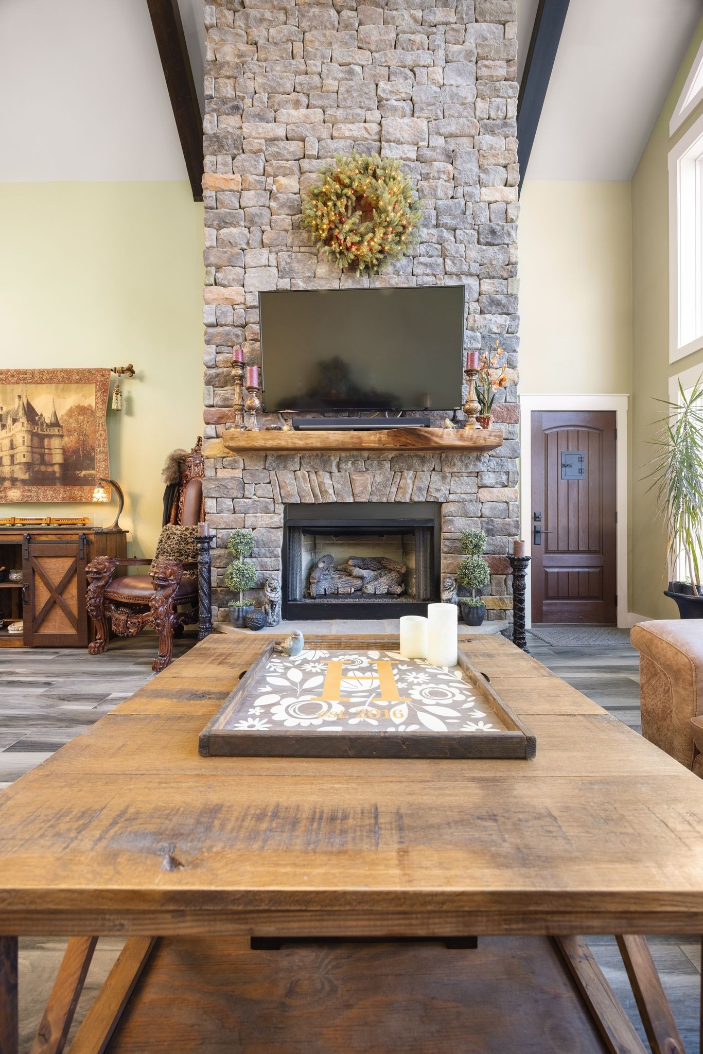 354 Mountain Farms Road Signal Mountain, TN 37377 - Photo 20 of 74 a living room with a fireplace and a flat screen tv