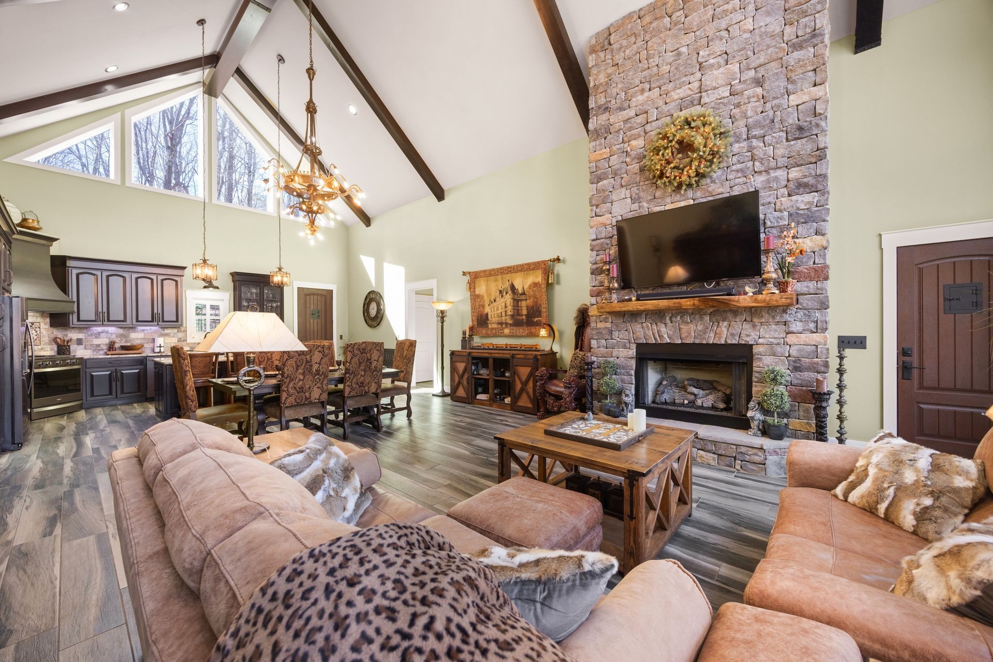 354 Mountain Farms Road Signal Mountain, TN 37377 - Photo 21 of 74 a living room with furniture a flat screen tv and a fireplace