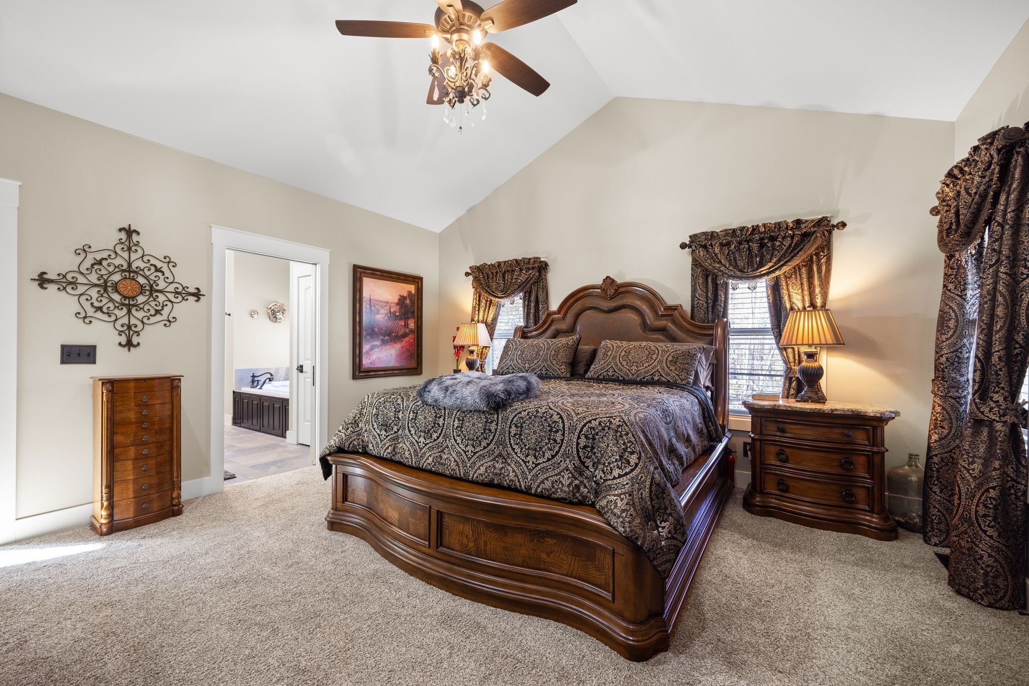 354 Mountain Farms Road Signal Mountain, TN 37377 - Photo 24 of 74 a spacious bedroom with a bed and a chandelier