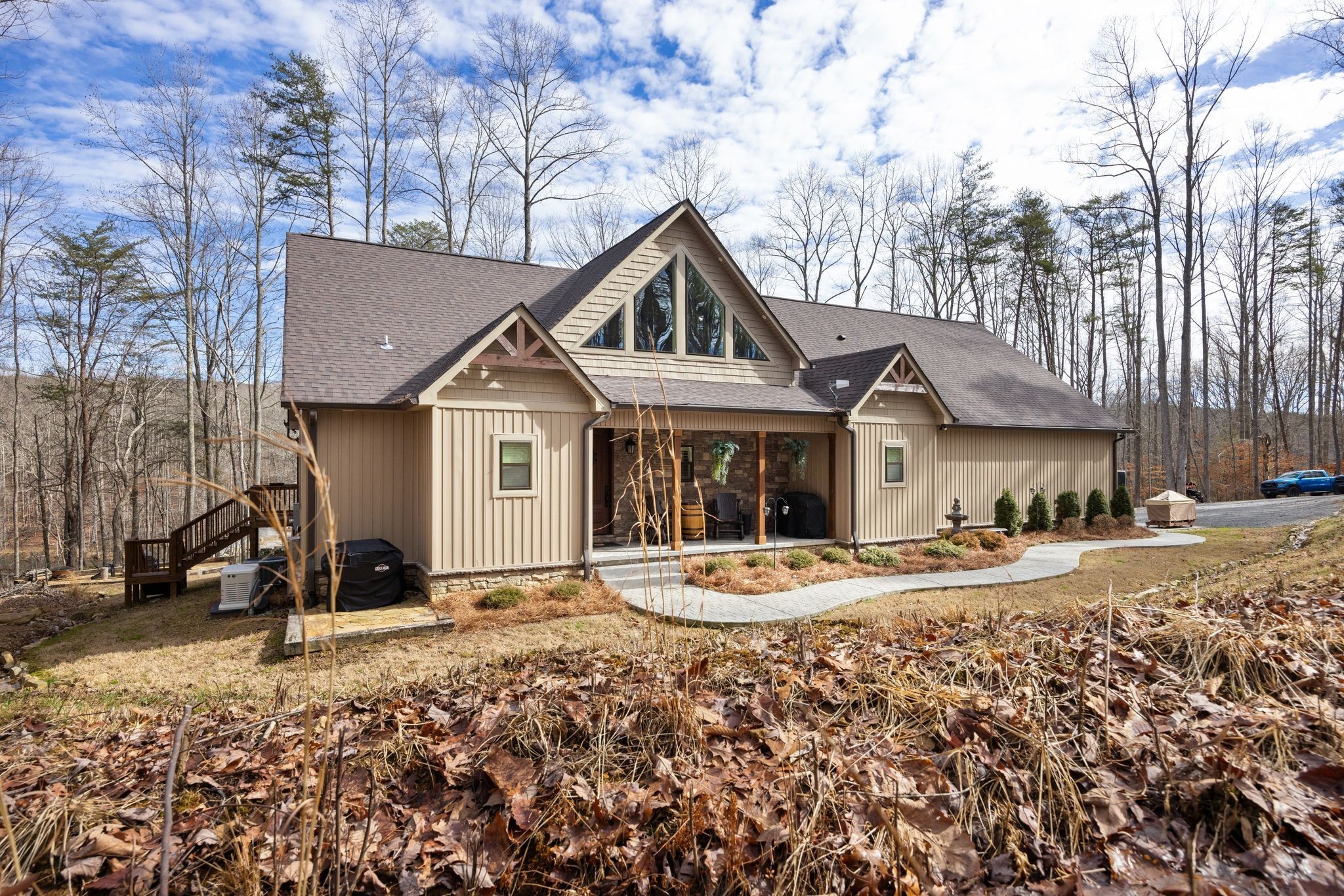 354 Mountain Farms Road Signal Mountain, TN 37377 - Photo 9 of 74 a front view of a house with a yard covered with snow in front of house