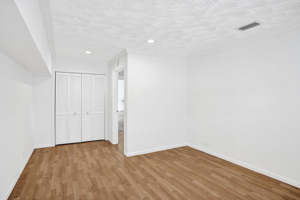 2632 Southeast 10th Court Pompano Beach, FL 33062 - Photo 16 of 49 a view of empty room with wooden floor