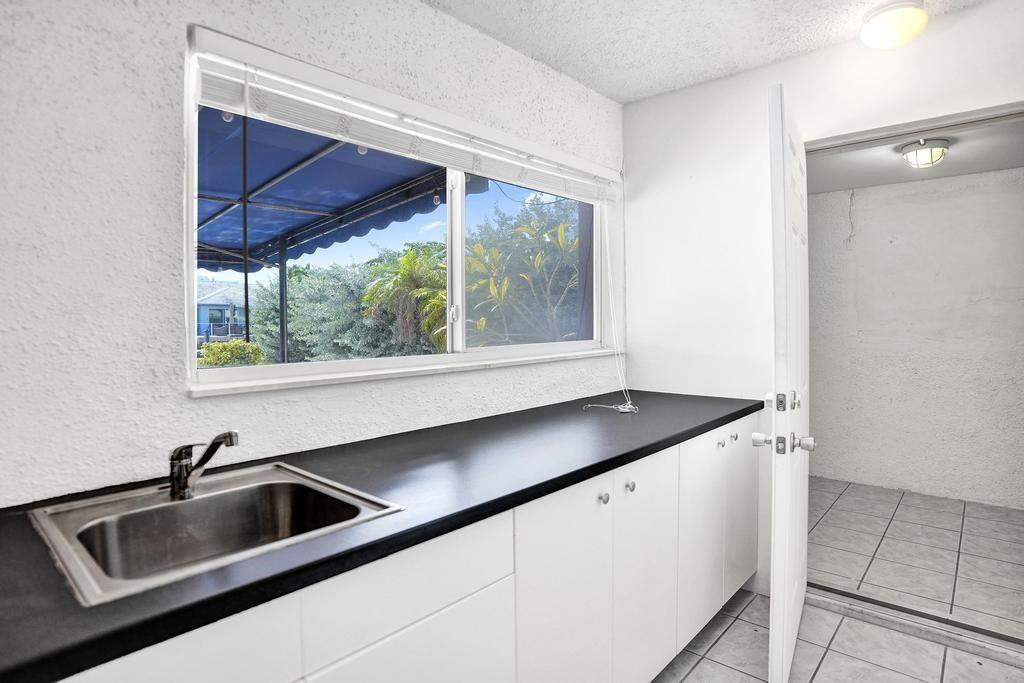 2632 Southeast 10th Court Pompano Beach, FL 33062 - Photo 17 of 49 a kitchen with a sink and a window