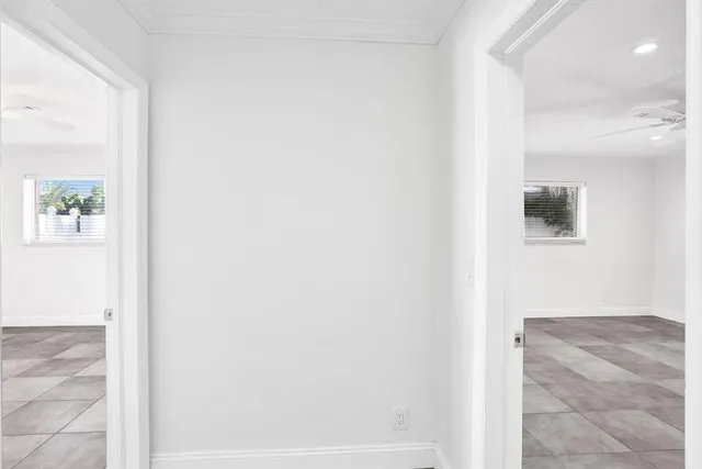 a view of a pathway of a house with a yard