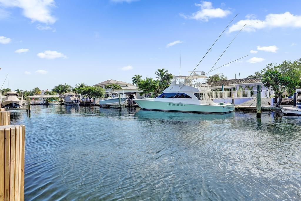 2632 Southeast 10th Court Pompano Beach, FL 33062 - Photo 44 of 49 a view of yard with swimming pool and outdoor seating