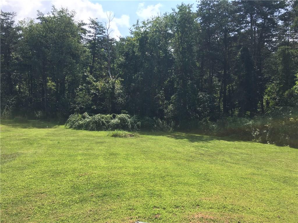 1040 Temple Road Monaca, PA 15061 - Photo 12 of 12 Backyard - View from deck. Woods along perimeter.