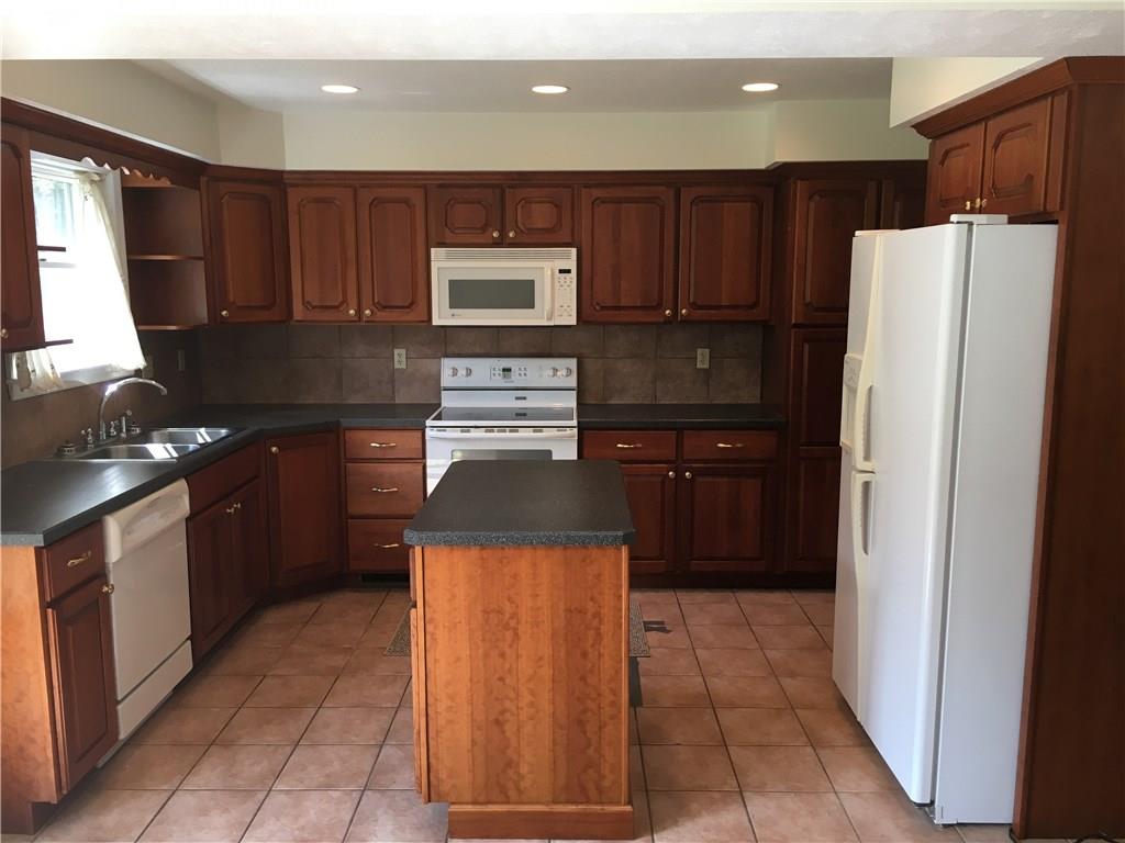 1040 Temple Road Monaca, PA 15061 - Photo 4 of 12 Kitchen 13x10 - Center Island All Appliances Included. Cherry Cabinets. Tons of Storage.