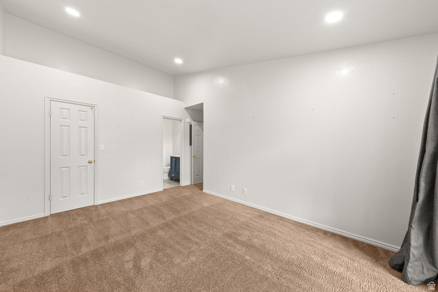 301 South 1200th Street East, Unit 31 St. George, UT 84790 - Photo 7 of 21 Unfurnished bedroom featuring ensuite bath, carpet floors, and recessed lighting