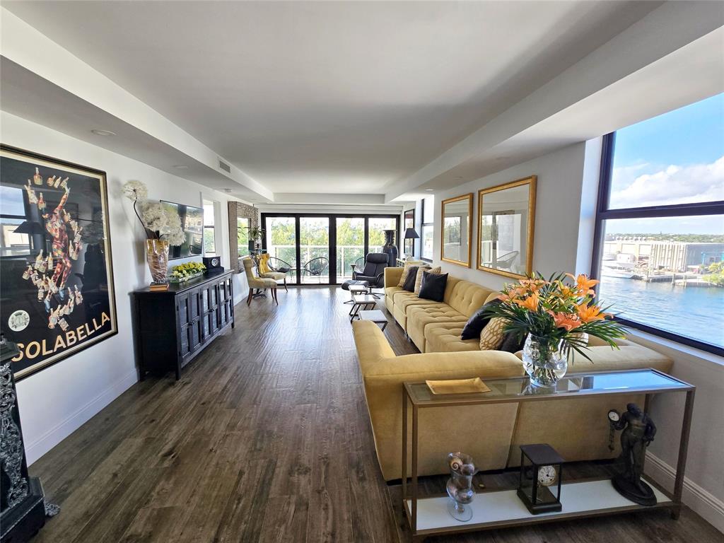 1401 North Riverside Drive, Unit 707 Pompano Beach, FL 33062 - Photo 1 of 32 a living room with furniture and wooden floor