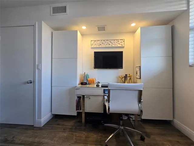 a bathroom with a double vanity sink toilet and shower