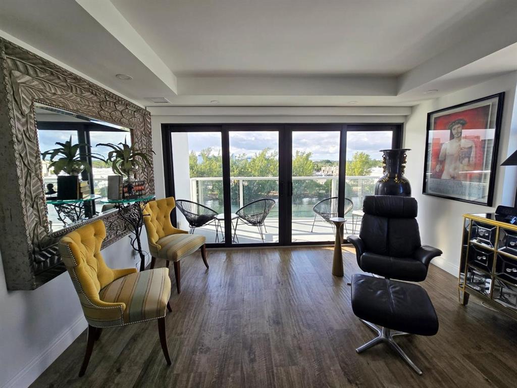 1401 North Riverside Drive, Unit 707 Pompano Beach, FL 33062 - Photo 3 of 32 a living room with furniture and a large window