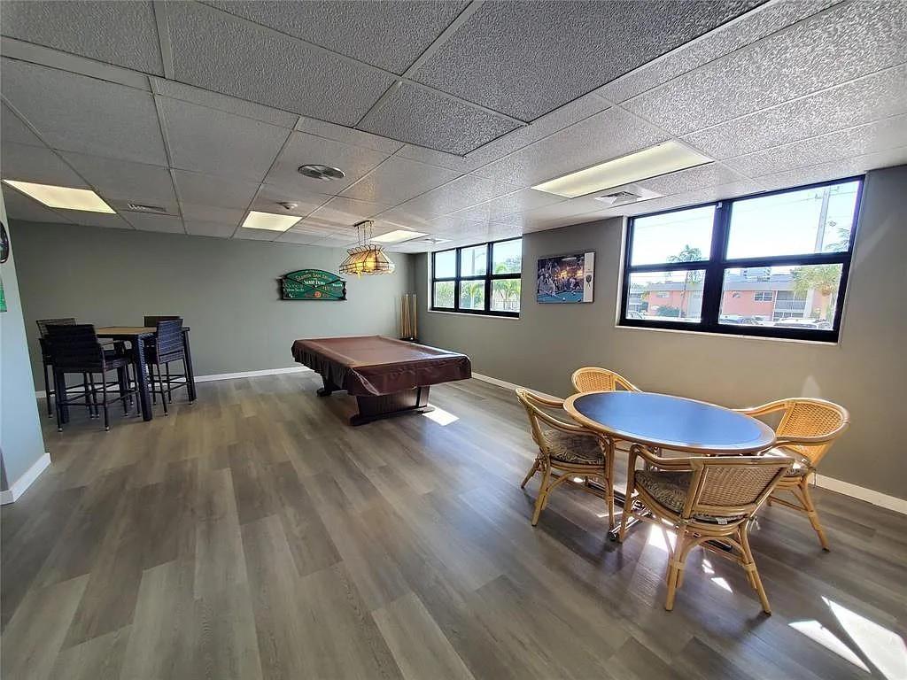 1401 North Riverside Drive, Unit 707 Pompano Beach, FL 33062 - Photo 31 of 32 a living room with furniture and a wooden floor