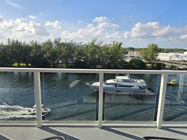 a view of a lake with chairs