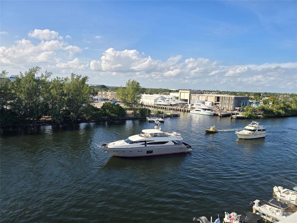 1401 North Riverside Drive, Unit 707 Pompano Beach, FL 33062 - Photo 5 of 32 a view of a lake with chairs