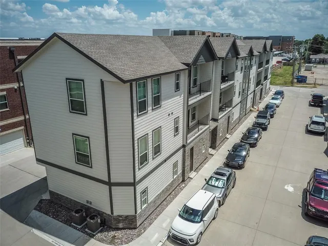 a view of a house with wooden deck