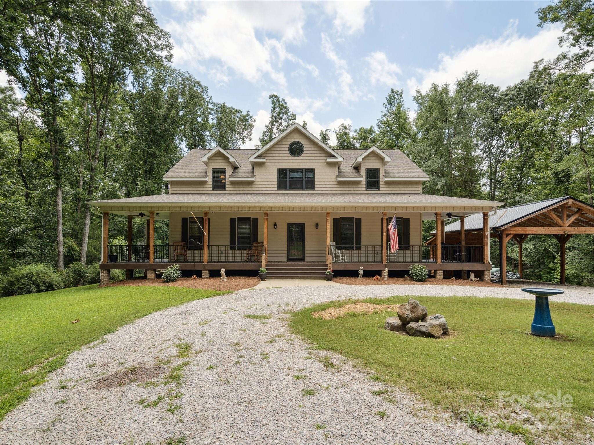 820 King Road Clover, SC 29710 - Photo 1 of 48 a front view of a house with swimming pool and sitting area