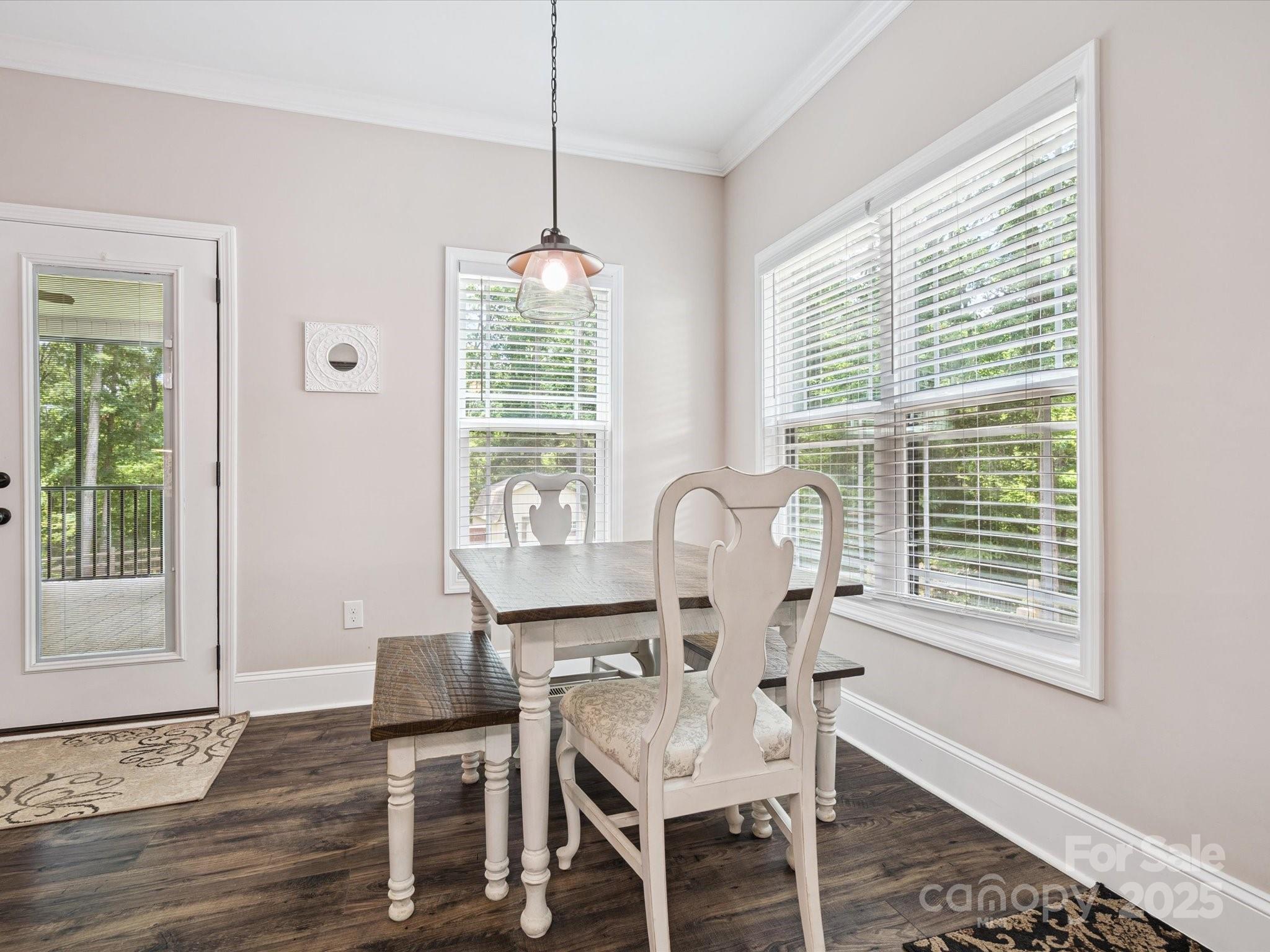 820 King Road Clover, SC 29710 - Photo 12 of 48 a dining room with furniture a chandelier and wooden floor