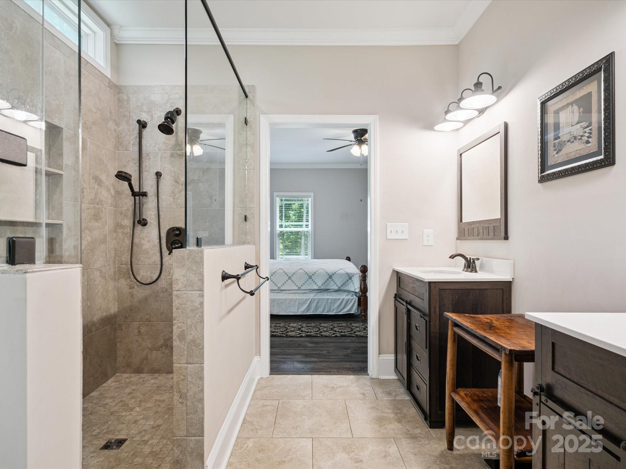 820 King Road Clover, SC 29710 - Photo 17 of 48 a bathroom with a double vanity sink a toilet a mirror and shower