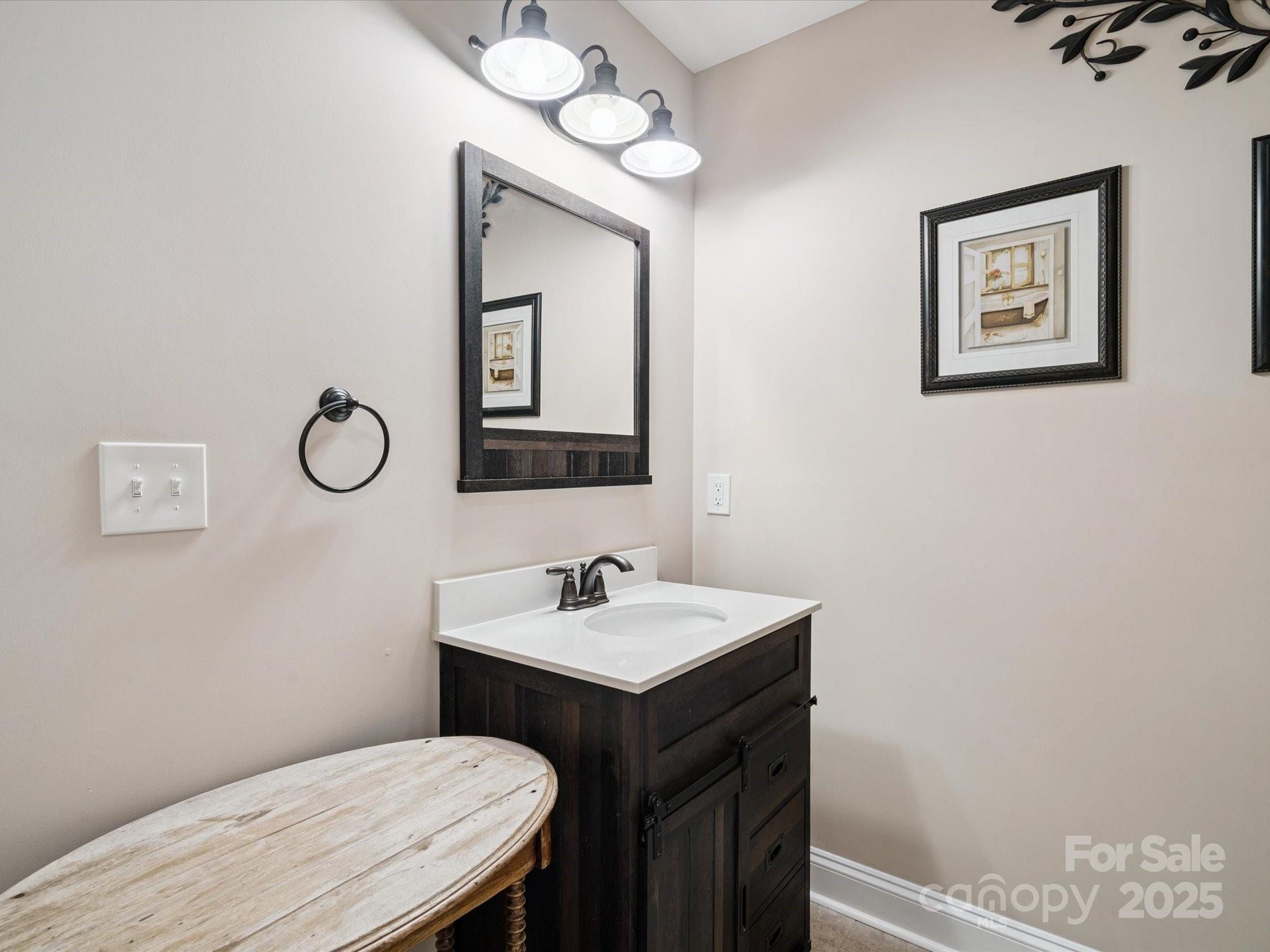 820 King Road Clover, SC 29710 - Photo 26 of 48 a bathroom with a toilet sink and mirror
