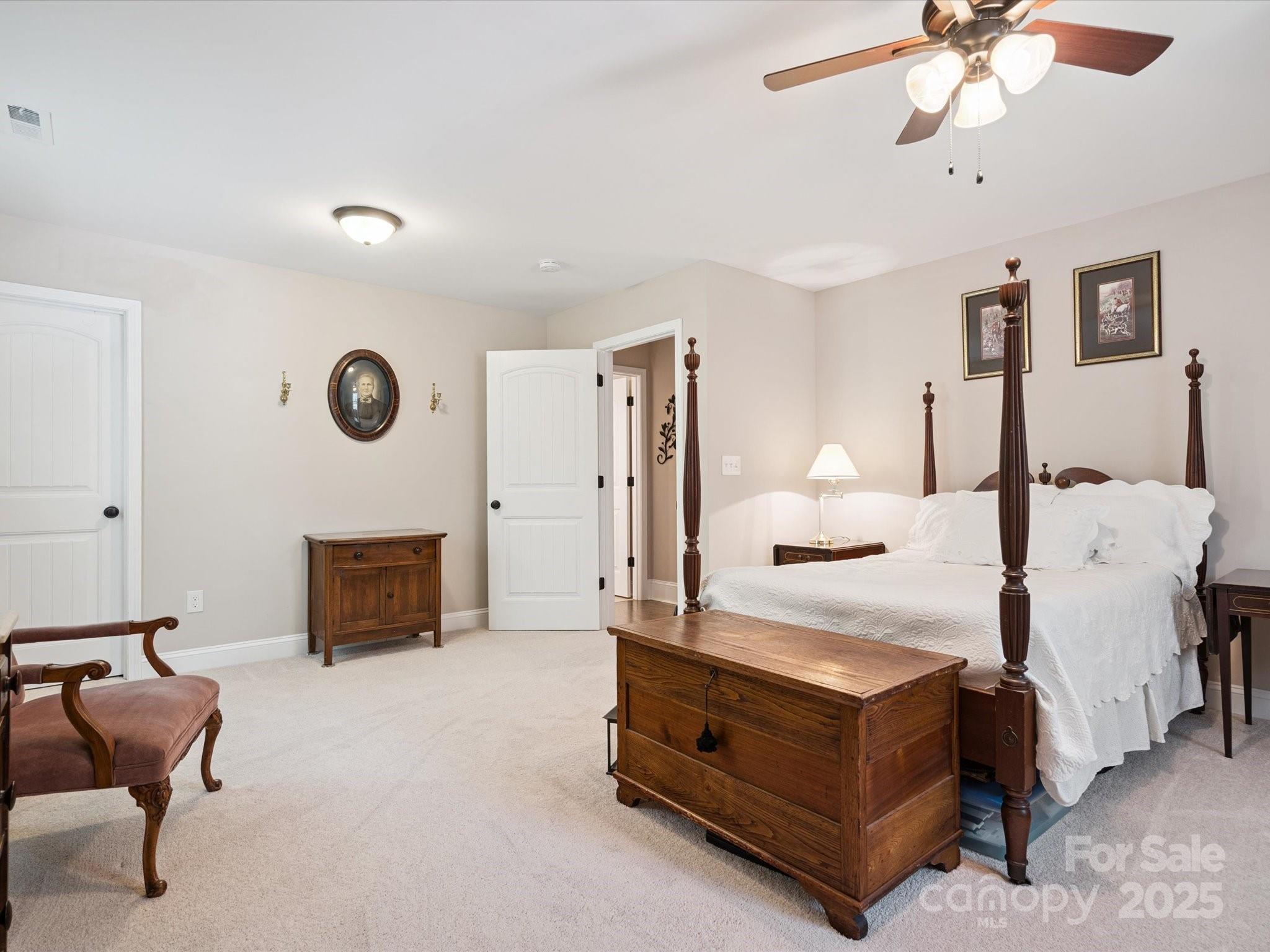 820 King Road Clover, SC 29710 - Photo 27 of 48 a spacious bedroom with a bed and a chandelier