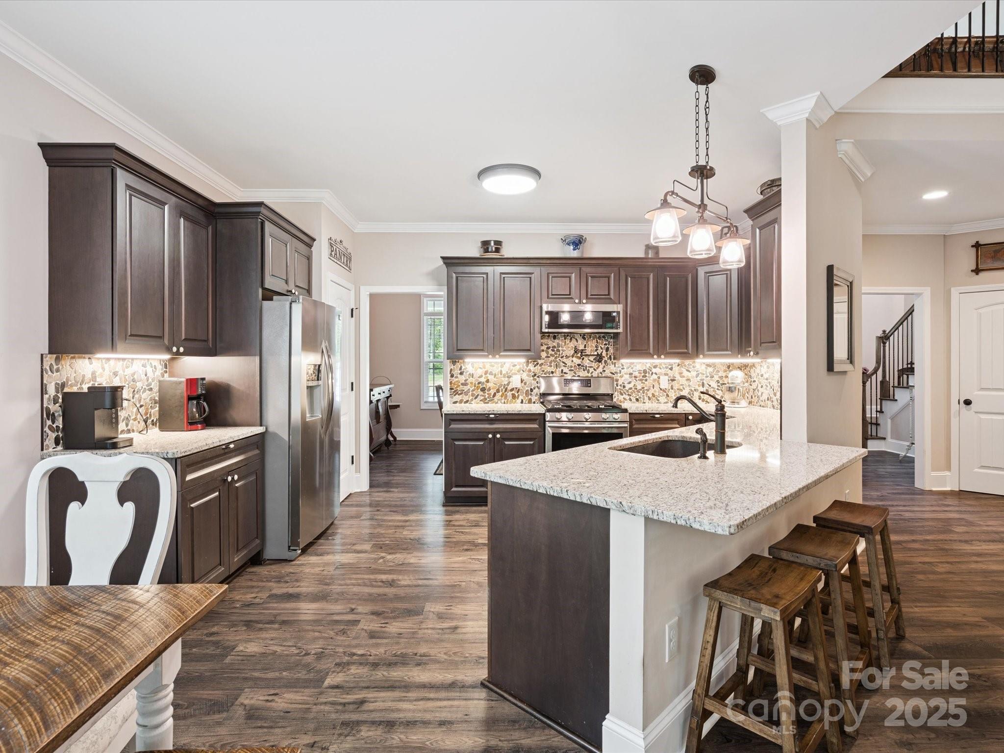 820 King Road Clover, SC 29710 - Photo 8 of 48 a large kitchen with granite countertop a sink counter top space and stainless steel appliances