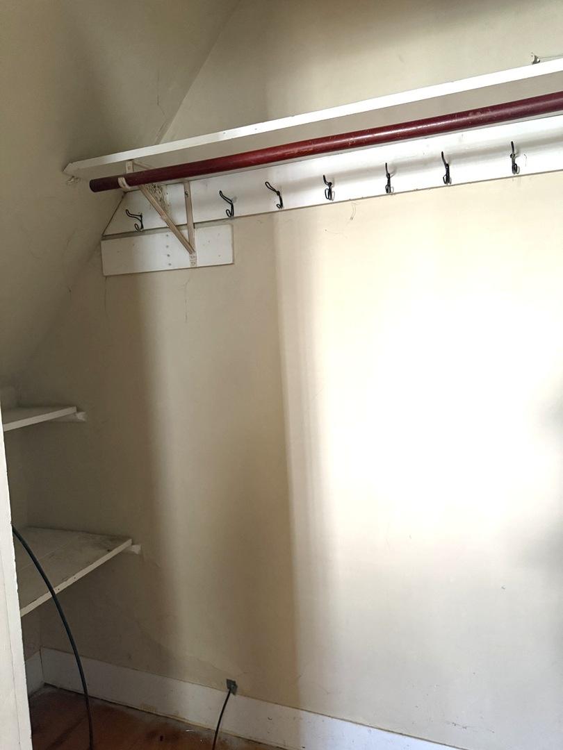 574 Herman Street Crete, IL 60417 - Photo 14 of 18 a view of a room with racks on the wall