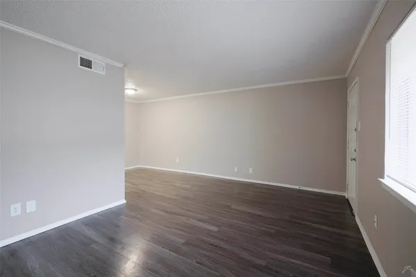 a view of an empty walk in closet